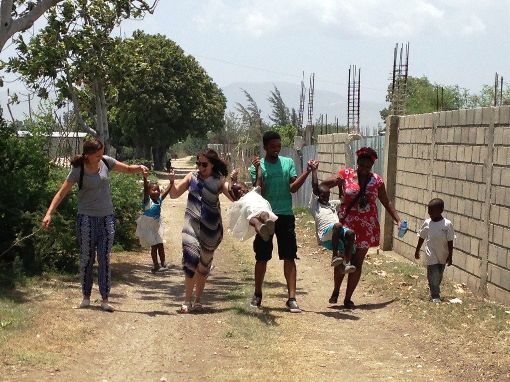 Drexel students playing with the kids 2015